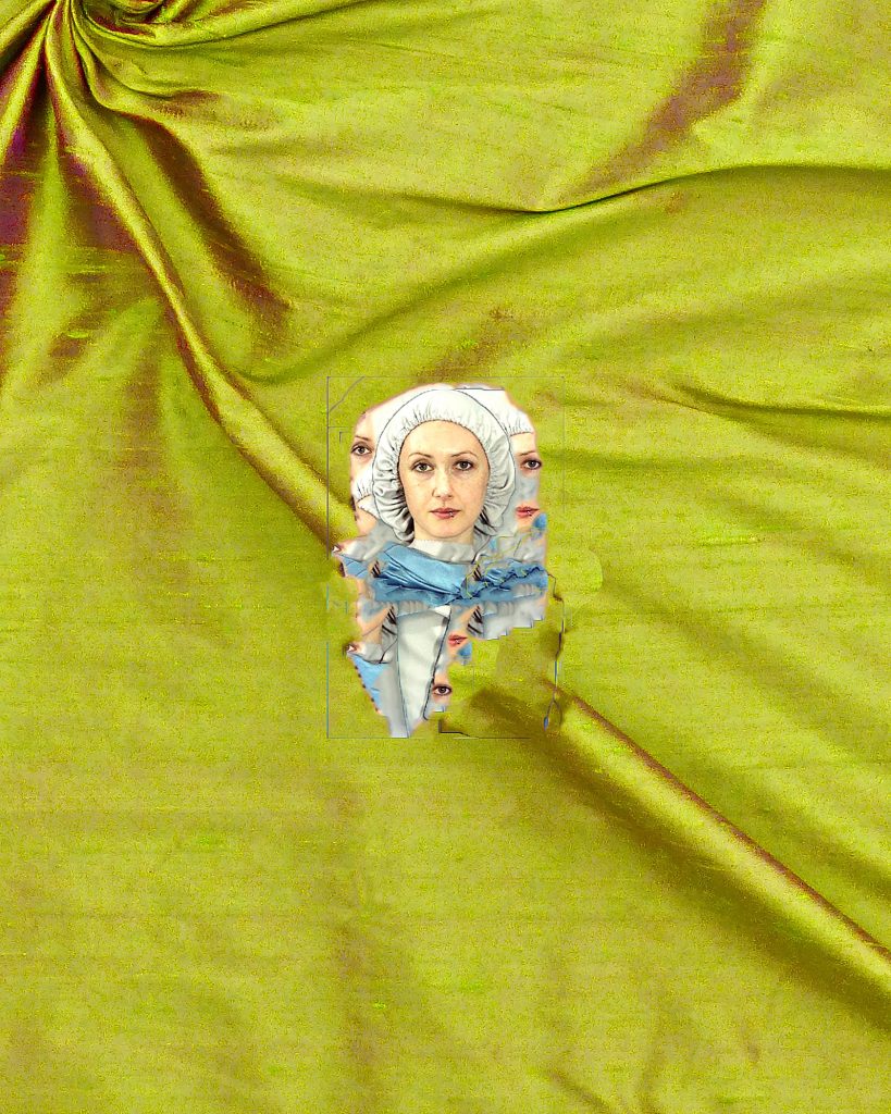 A doll is peeking out of a green fabric