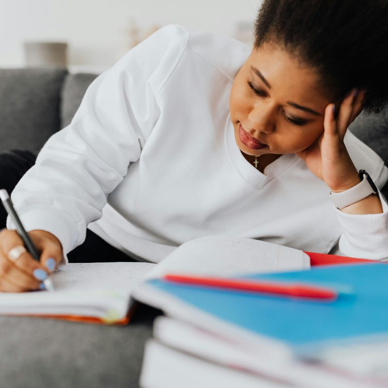 woman writing in a notebook